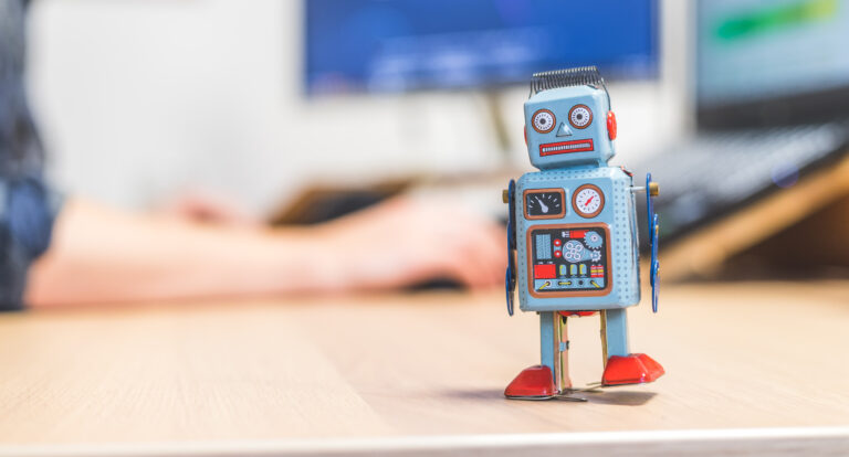 Little toy robot on a desk top